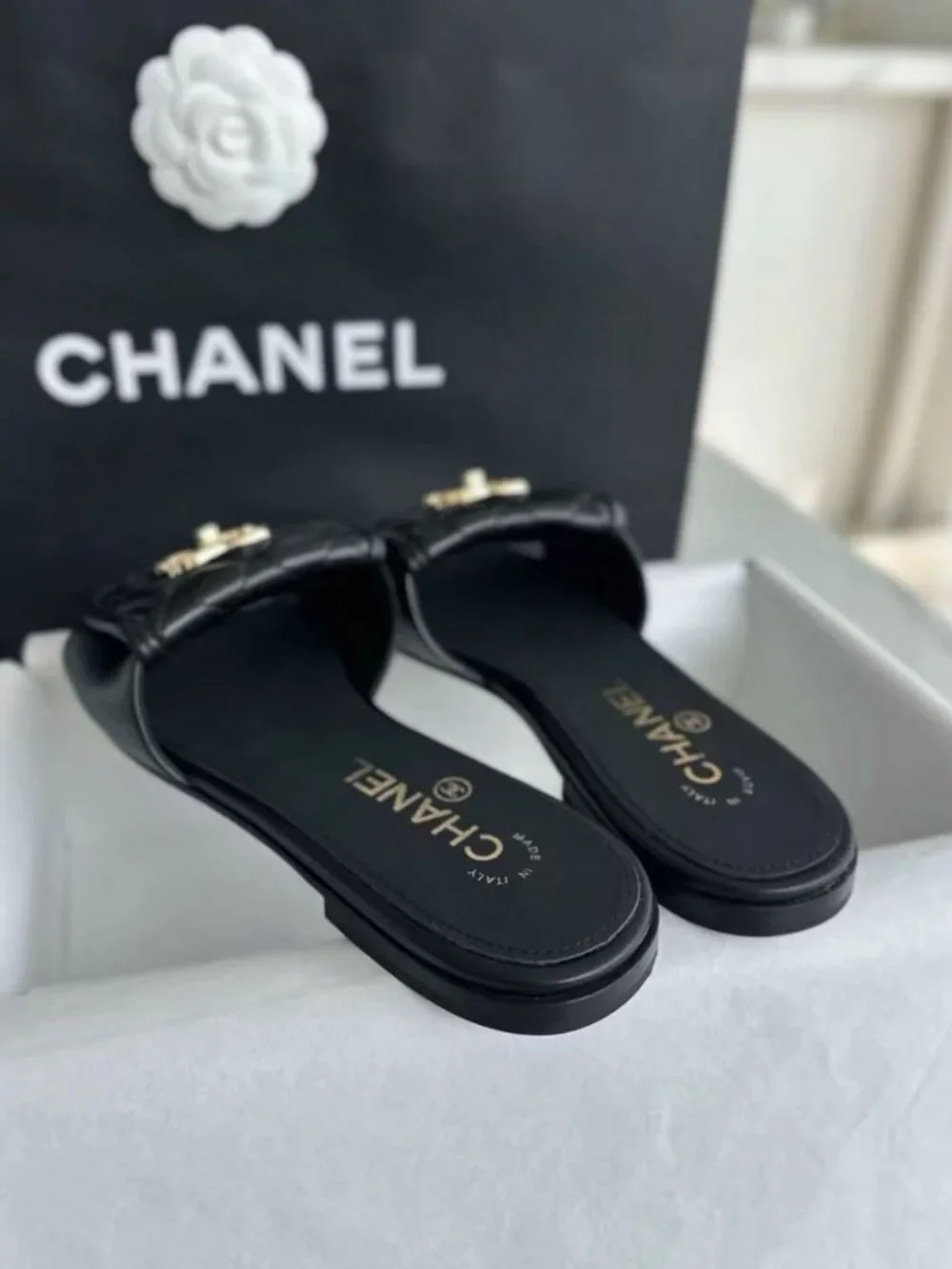 CHANEL Black Quilted Leather CC Turn‑Lock Flat Slide Sandals